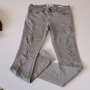 Frame Denim Distressed Skinny Jeans in Gray